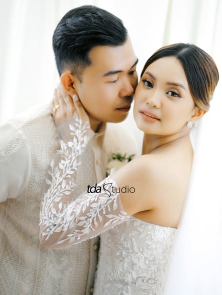 Newlyweds posing together after their ceremony