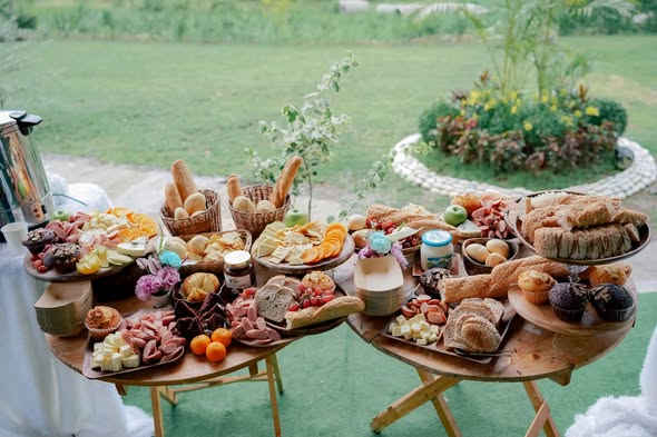Abundant grazing table arranged for an outdoor celebration